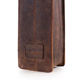 A close-up of the Banbury Wine Carry Bag by Vintage Leather Sydney shows its brown, weathered full-grain leather, visible stitching, and a rectangular patch embossed with a bear and Wild for Leather, set against a white background.