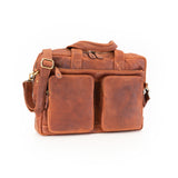 The Leather Messenger Bag Zenith by Vintage Leather Sydney features two front pockets, a top handle, and an adjustable shoulder strap. Shown in brown leather on a white background.